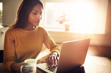 Image of a lady working on a computer