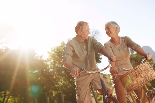 Image of two people riding bicycles.