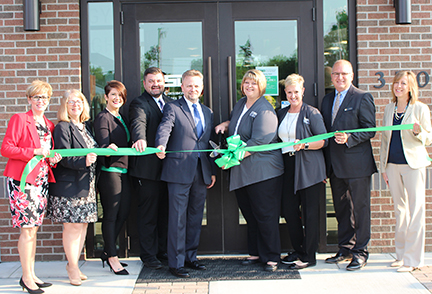 Project team cutting ribbon