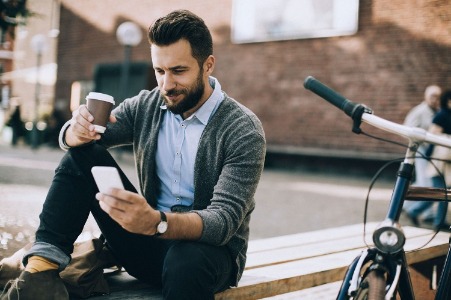 Image of a man texting