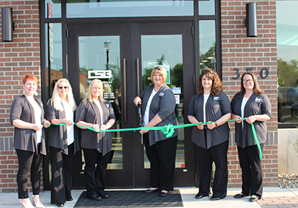 Banking Center Staff cutting ribbon