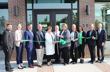 Chamber and main street wooster cutting ribbon