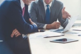 Image of two people in a meeting