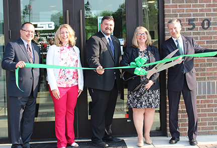 Senior Management cutting ribbon