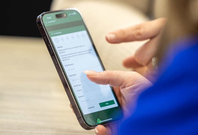 Person using a mobile banking app on a smartphone.