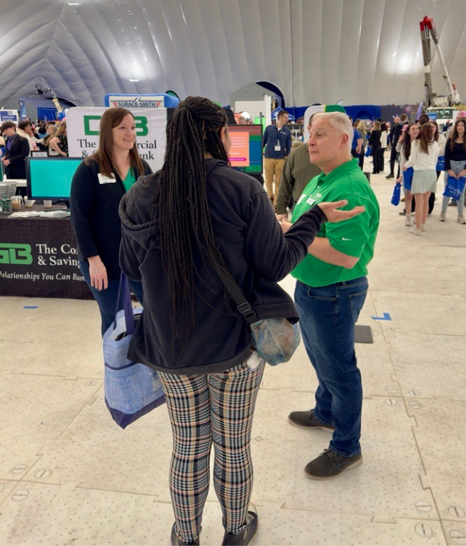 CSB employees speaking with student at local career event