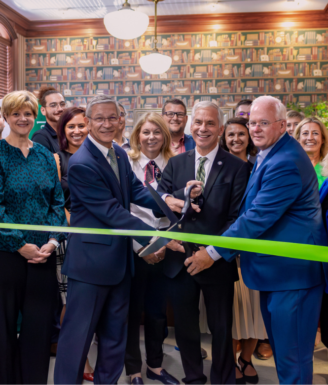 Ribbon cutting ceremony for CSB Medina loan office with team and community members.